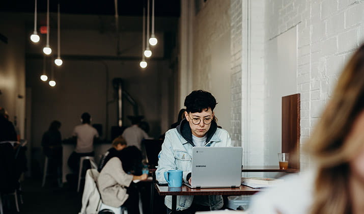 female-studying-in-a-cafe-with-laptop